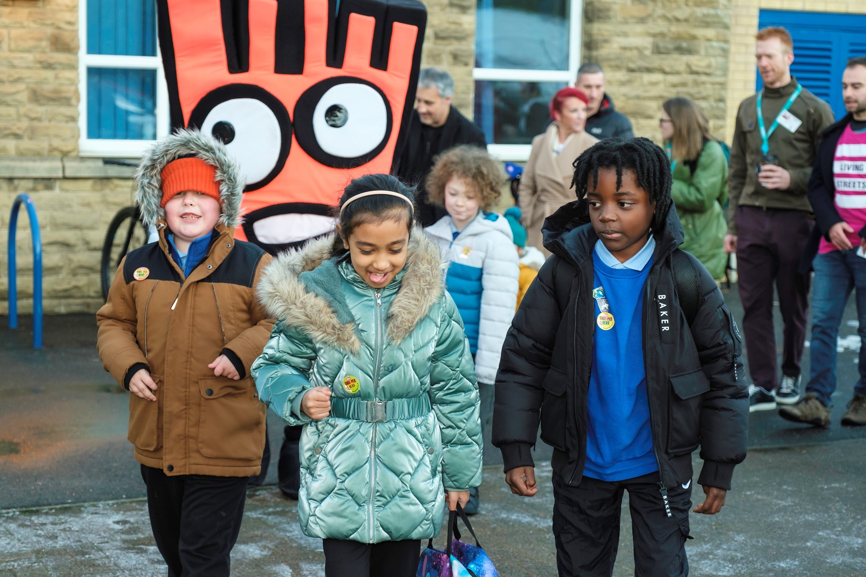 A photo of primary school pupils with Louise Haigh MP and Ed Clancy OBE