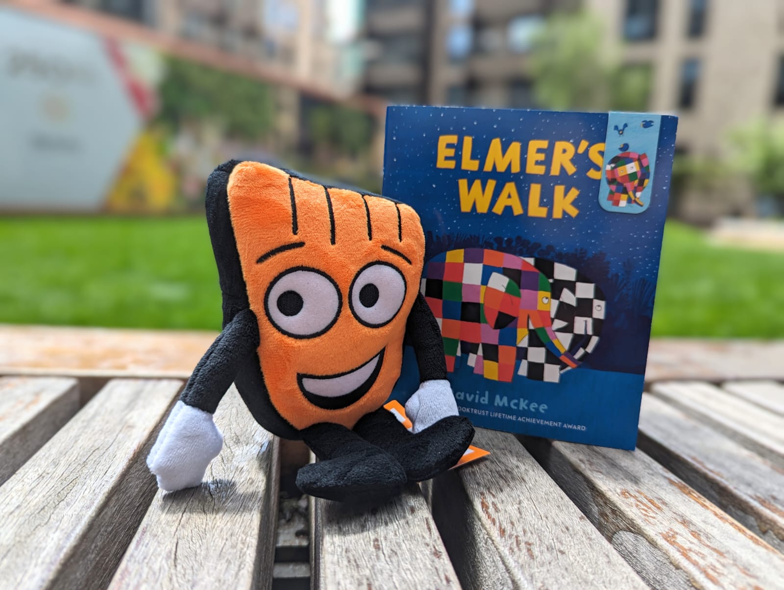 A small Strider plush with a copy of Elmer's Walk